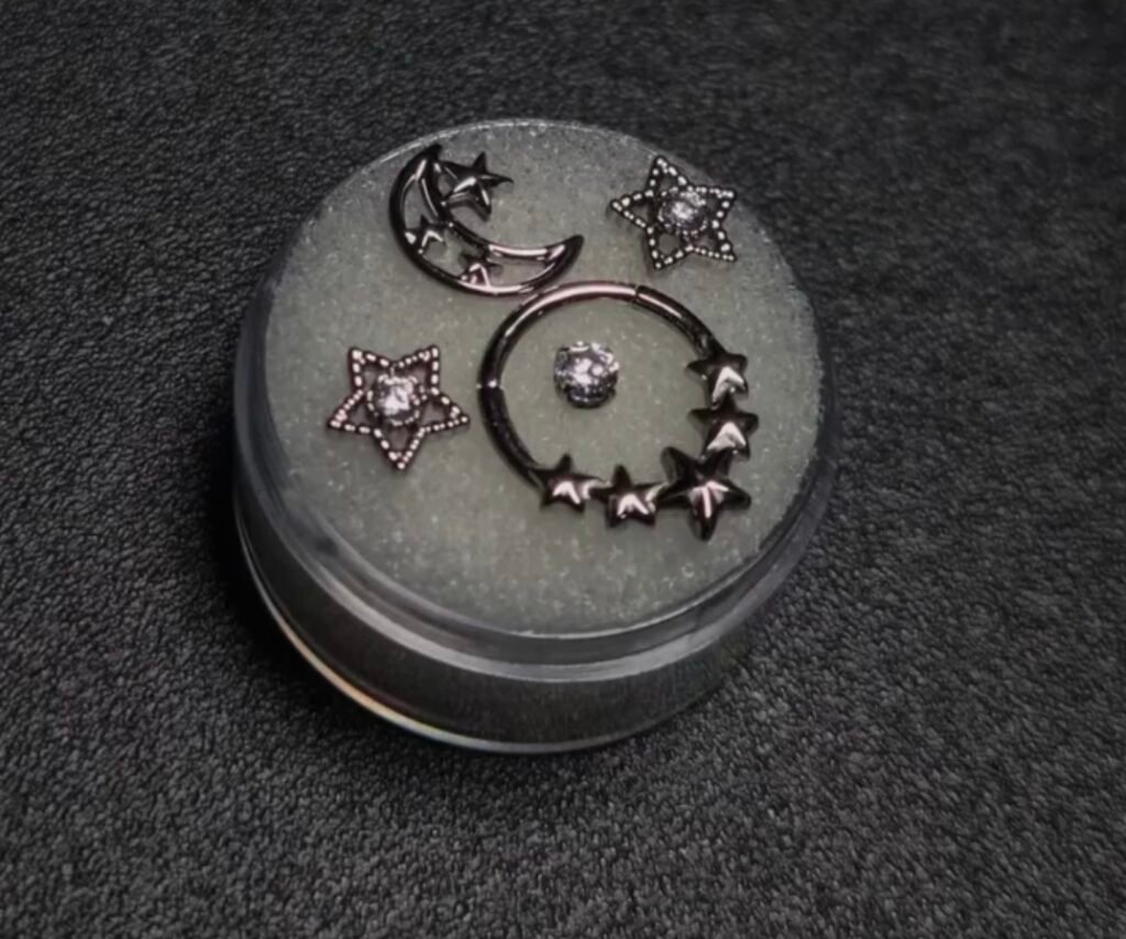 Celestial piercing jewelry arranged on a display