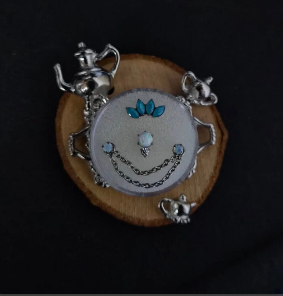 Decorative piercing jewelry arranged on a styled display